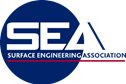 Surface Engineering Association logo - white text with a red line and dark blue circle on a pixelated background