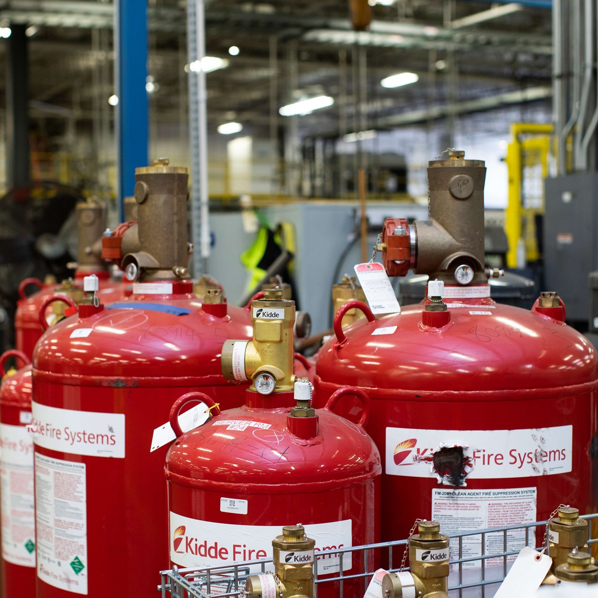 Very large fire protection cylinders surrounded by smaller fire extinguishers