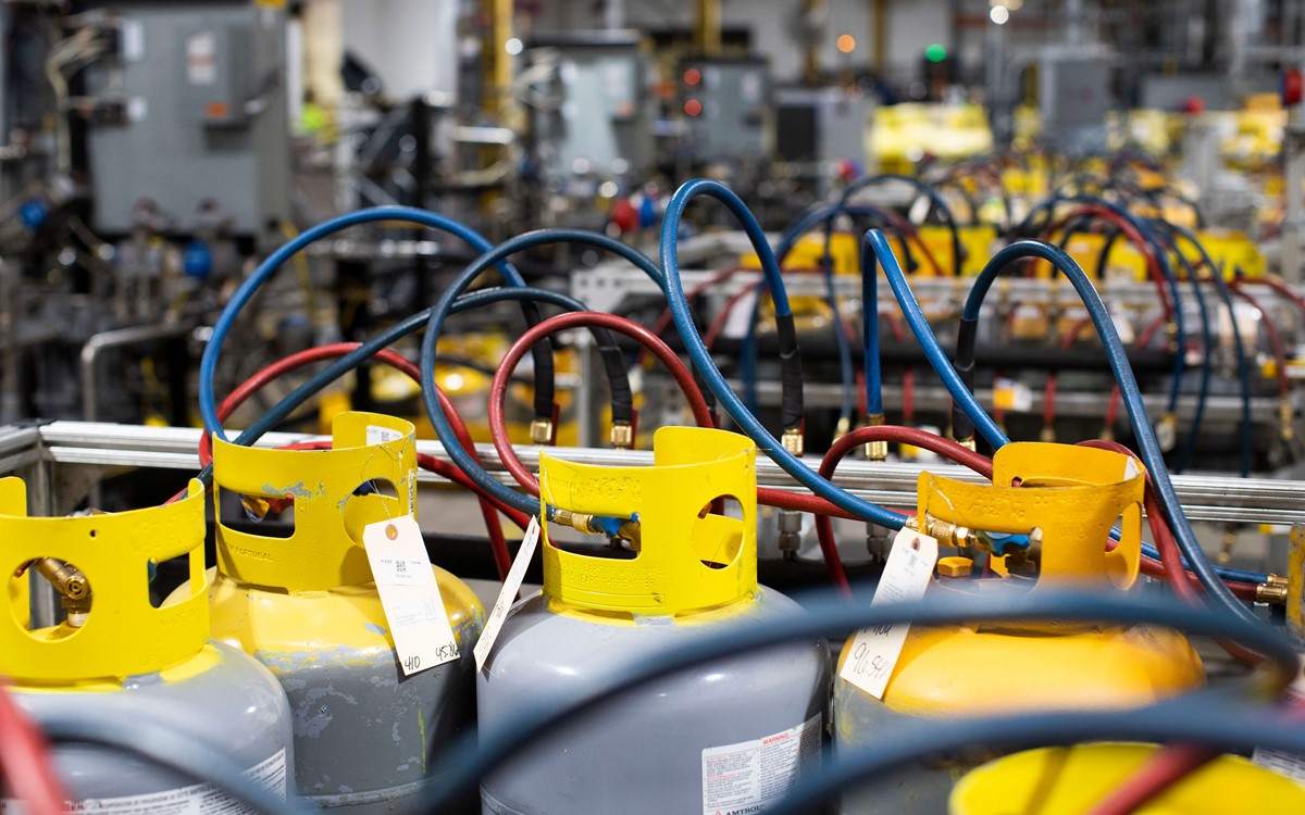 Recovery cylinders in a warehouse with wires connected to them