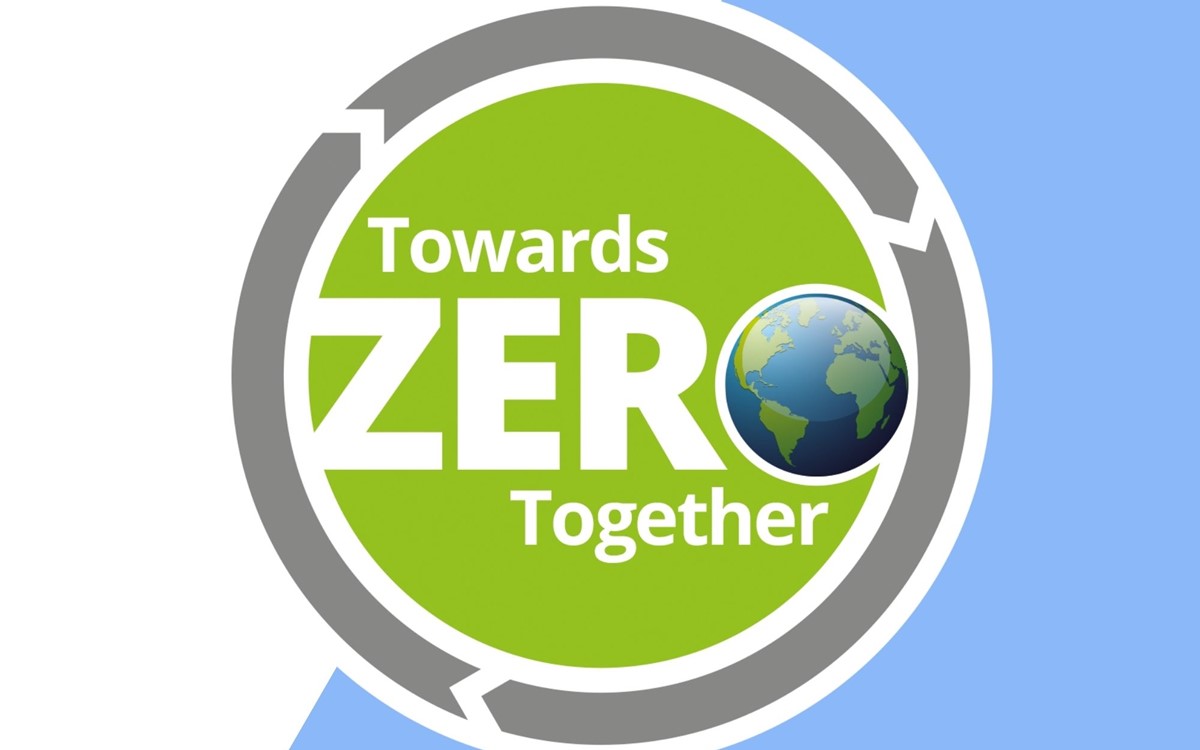 White text on a green and grey circle on a blue and white background