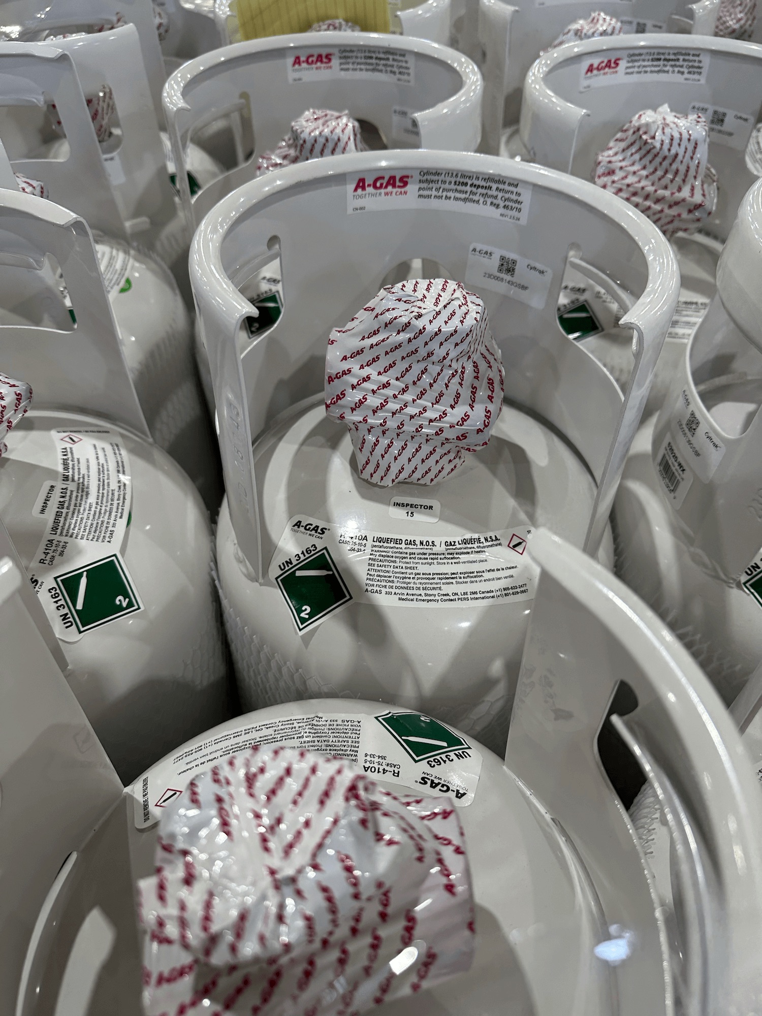 The top of grey cylinders with wrapping around the valves 