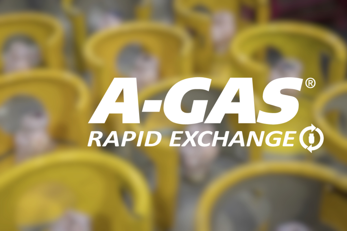 White text on a blurred background of cylinders with yellow tops